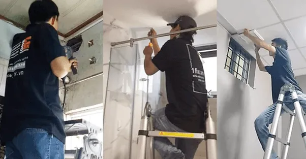 Kỹ thuật viên đo đạc kích thước khung quạt trước khi tiến hành khoét lỗ trần